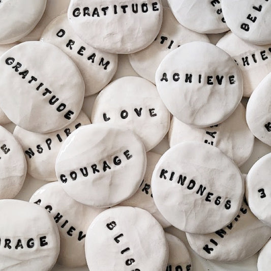 touch stones with positive words engraved